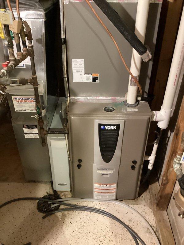 Performed routine maintenance on a 12-year-old natural gas furnace. Inspected all components including electrical connections, gas pressure, flame sensor, igniter, and condensate lines; all were in good working condition. Unit is operating properly with no issues identified.