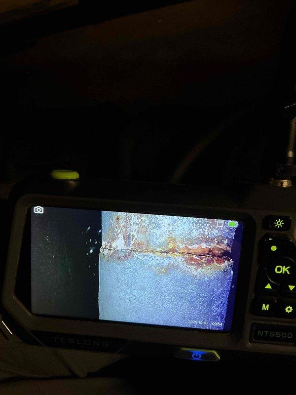 Replaced induced draft motor on 14-year-old furnace as per scheduled repair. Inspection using NT550 endoscope revealed multiple heat exchanger tube failures with visible corrosion and elevated carbon monoxide levels during combustion analysis, rendering unit unsafe to operate. Homeowners opted for service advisor consultation regarding furnace replacement options.