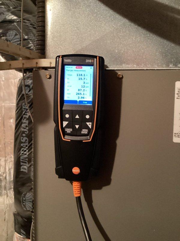 Performed routine tune-up on 18-year-old Lennox furnace. System is operating safely with good igniter and flame sensor condition, though showing signs of age with inducer pulling high amps, oil on blower motor, and some rusting on copper line. Combustion analysis confirmed proper operation with 87.2% efficiency. Recommended humidifier pad replacement.
