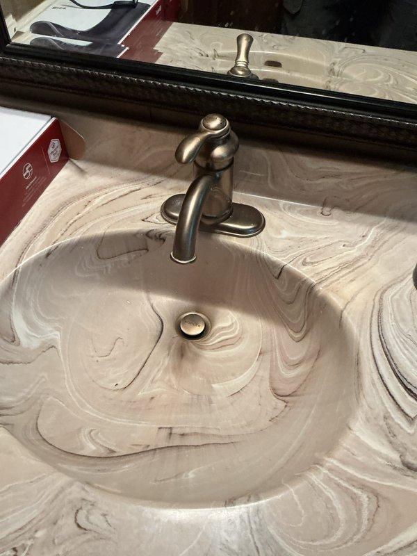 Installed customer-supplied bathroom and kitchen faucets in 1979 home to address multiple leaking fixtures. Completed full toilet installation with associated plumbing work including new shut-offs. Also performed hot water line service and disposal-related plumbing while re-piping various connections to ensure proper functionality.