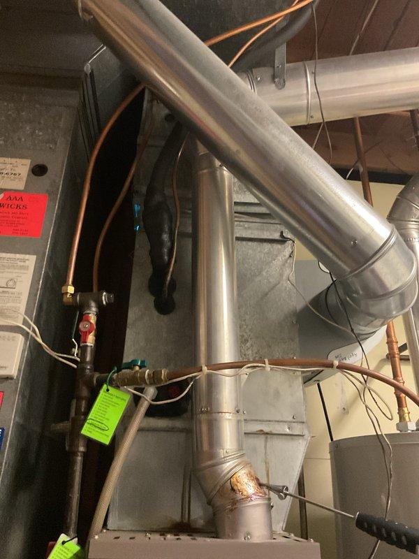 Completed scheduled furnace tune-up on 17-year-old unit. Identified gas valve leakage and signs of inducer motor failure. Recommended system replacement due to advanced age and multiple critical component issues.