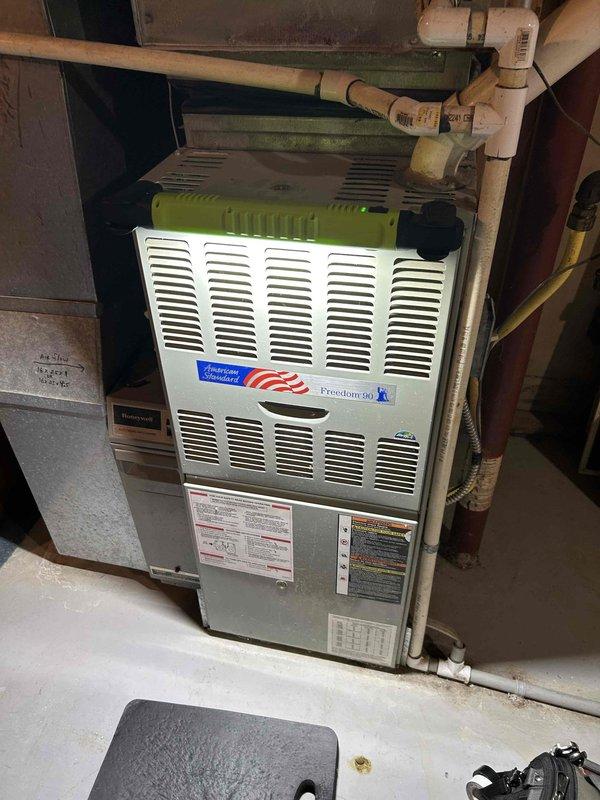 During scheduled furnace tune-up on 22-year-old American Standard FRP system, discovered cracked heat exchanger at crimp location. Carbon monoxide test revealed elevated levels at 16ppm. Documented damage with camera inspection shared with homeowner, completed 911 form due to safety concern, and provided replacement options for heat exchanger or complete system. Gas pressure measured at 3.3 WC with no adjustment needed. Homeowner opted for temporary gas leak protection (TGL) while considering replacement options.