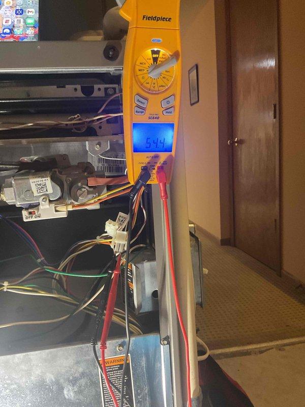 Performed annual maintenance tune-up service on two furnaces. During inspection, identified a dirty filter that was impacting system performance and replaced it with a new one. Completed electrical testing on system components with readings measuring 544V, confirming proper voltage supply to both units.