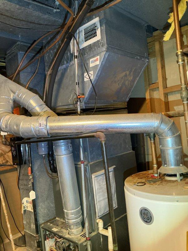 Replaced outdated 40-gallon water heater with new 50-gallon TGL unit due to leaking condition. Addressed possible obstruction in ventilation system and resolved leak issue. Installation completed in utility room with proper connection to existing plumbing and venting systems.