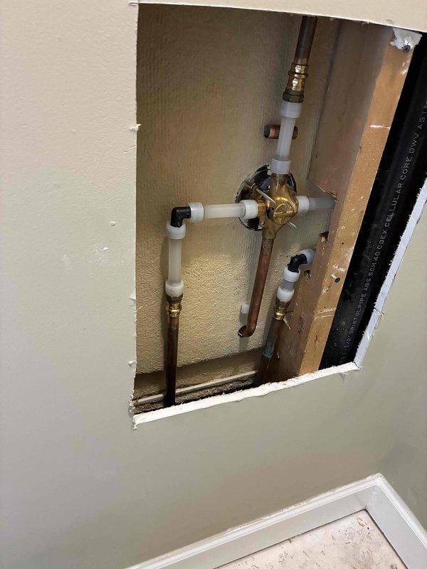 Performed inspection and replacement of bathroom sink faucet with new fixture, including repair of non-functioning cold water valve. Access panel was created to properly service the plumbing infrastructure, revealing copper and PVC piping configuration that required attention. Successfully installed PRIER valve to resolve water flow issues.