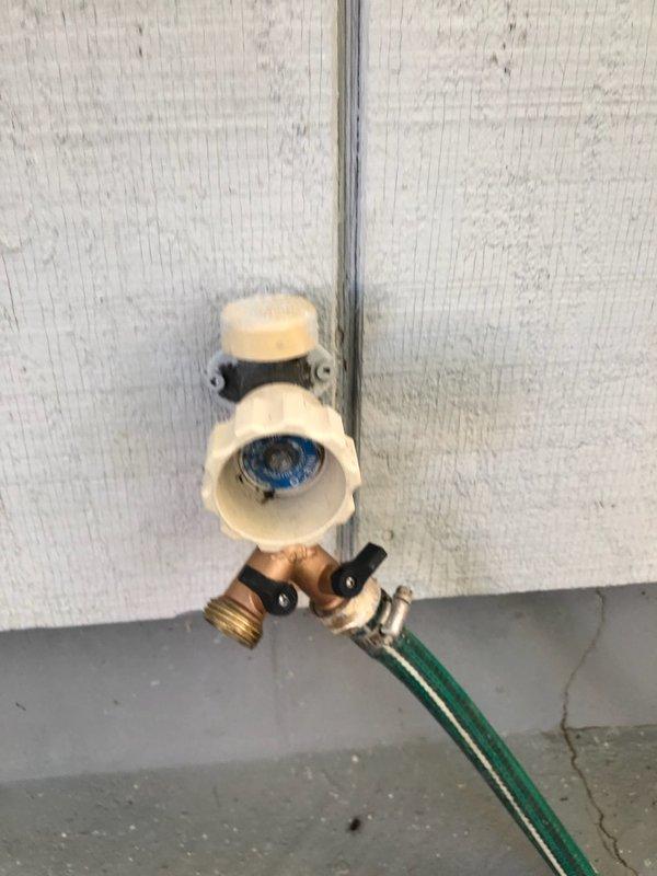 Replaced damaged frost-proof Prier hose bibb due to broken handle and sheared screw in stem. Installed new assembly with Y-splitter, ensuring proper connection and functionality. Unit now operates correctly with both water outputs accessible via dual control knobs.