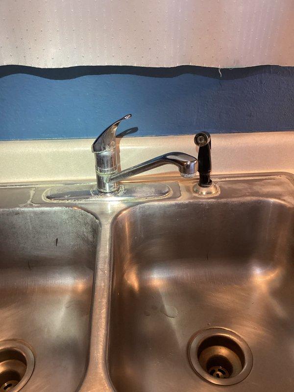 Completed shower valve replacement in bathroom with new Oakdale Warehouse Shower Valve & Trim Kit, including shower control, arm, head, and spout. Also installed new kitchen faucet, providing customer with improved single-lever operation and water-conserving features.