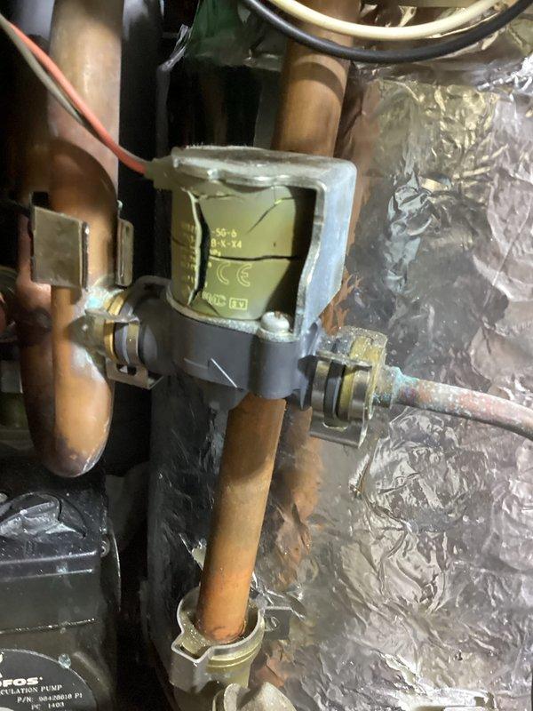 Inspected non-functioning boiler system that was presenting an E1 error code (blower speed fault). Confirmed damaged blower fan with significant noise issues and discovered a large hole in the exhaust elbow at the bottom of heat exchanger. Informed customer that the boiler brand is no longer manufactured or supported, and customer has elected to proceed with complete boiler replacement.