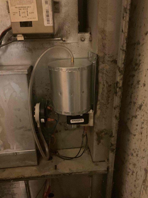 Completed replacement of failed inducer draft fan motor on furnace unit. Sourced replacement part from Johnstone Bloomington and installed new component to restore proper system operation. Visual inspection confirmed correct installation of all connections and proper functioning of the replaced assembly.