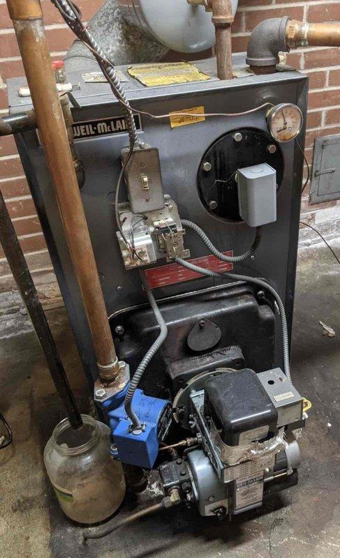 Performed routine maintenance on Weil-McLain oil boiler per agreement. Replaced nozzle and oil filter during standard tune-up service. Conducted operational testing to verify proper function with no leaks detected.