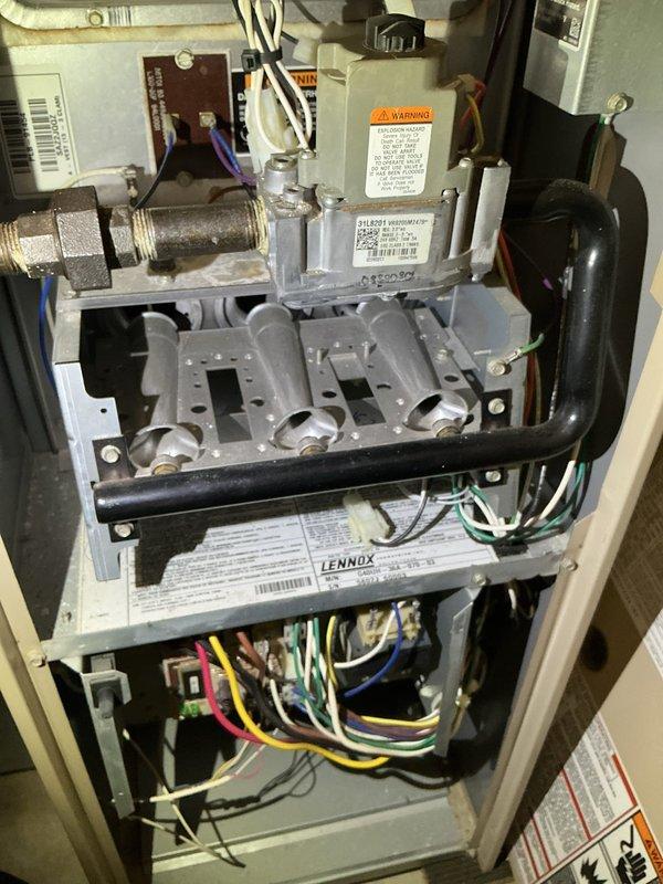 Performed annual maintenance tune-up on 23-year-old Lennox 80% furnace. Noted inducer motor drawing 2.28 amps, exceeding rated 1.9 amps specification. Recommended replacement of inducer motor or complete system replacement due to age and performance issues. Discussed findings with homeowner.