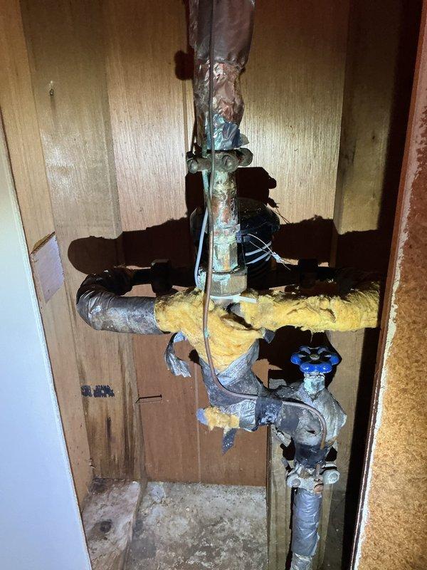 Diagnosed and repaired a water leak at the valve connection on pipe leading to exterior faucet. Observed significant corrosion and deterioration on copper pipe with damaged insulation and water damage to surrounding wooden structure. Provided bid for main line rebuild due to extensive system deterioration.