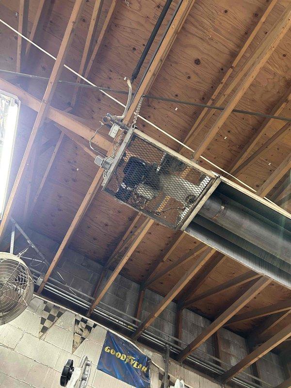 Responded to no-heat call for a commercial garage with overhead radiant heating and oil burner system that had been dormant for 4 years. Diagnosed seized inducer motor on tube heater, manually freed the blade which restored operation. Noted significant inducer switch chatter during testing; recommended replacement of switch and installation of relay to prevent continuous fan operation while maintaining proper system functionality.
