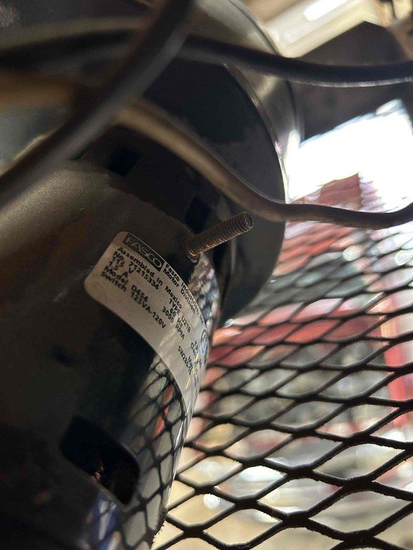 Responded to no-heat call for a commercial garage with overhead radiant heating and oil burner system that had been dormant for 4 years. Diagnosed seized inducer motor on tube heater, manually freed the blade which restored operation. Noted significant inducer switch chatter during testing; recommended replacement of switch and installation of relay to prevent continuous fan operation while maintaining proper system functionality.