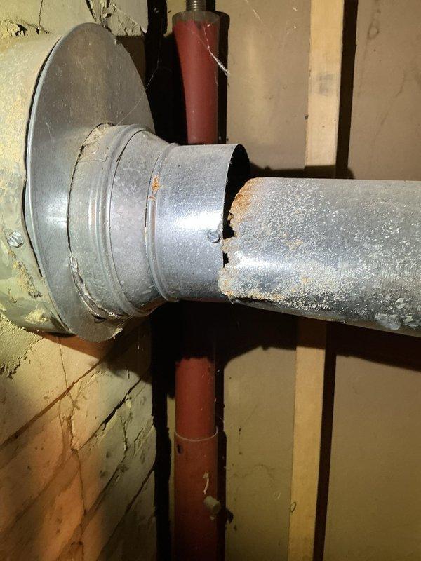 During inspection of the 22-year-old HVAC system, diagnosed multiple critical failures including damaged exhaust venting, blower motor leaking oil, and corroded ignition components. Due to these significant safety concerns, performed a system shutdown. Recommended complete system replacement as primary option, with alternative solutions being replacement of blower motor and ignition assembly along with exhaust vent repairs.