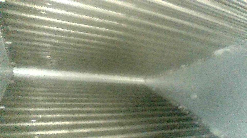 Performed comprehensive tune-up on five-year-old Arco air furnace. Inspected heat exchanger (good condition), cleaned flame sensor and condensate trap, and verified proper capacitor function. Confirmed normal operation in both first and second stage firing sequences with no issues detected.