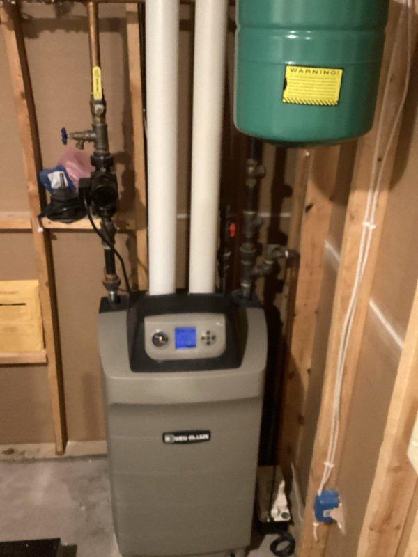 Responded to no heat call for Weil-McLain Ultra LP boiler system installed in 2010. Diagnostic testing revealed flame detection failure. Removed and cleaned flame sensor, accessed heat exchanger for thorough cleaning, and performed system flush to restore proper operation. Post-service verification confirmed boiler now functioning correctly with normal flame detection.