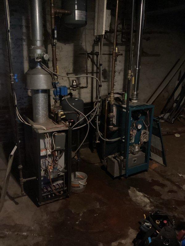 Performed replacement of expansion tank, pressure/temperature relief valve, and auto fill valve on dual boiler system. Properly installed all components per estimate specifications, ensuring correct water pressure settings. Following installation, successfully restarted both boilers, verified proper heating operation, and confirmed all systems functioning normally.