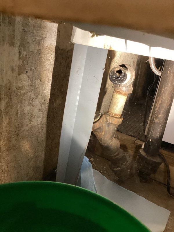Repaired leak issues in laundry tub and drain system by replacing compromised P-trap assembly and boiler drain. Visual inspection revealed significant corrosion at connection points with active leaking that required immediate attention. Installation of new components restored proper drainage function and eliminated all leak points.
