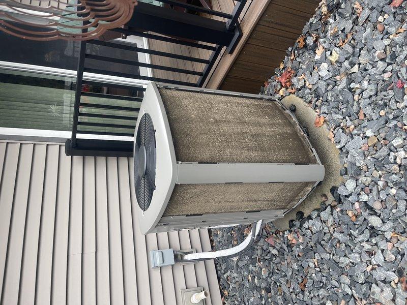 Responded to customer complaint of pulsating/whooing noise from outdoor heat pump unit during operation. Discovered condenser coil was significantly restricted with debris, causing airflow starvation which resulted in unit vibration. Removed shroud, thoroughly cleaned condenser coil, and completed full heat pump tune-up. System operated normally after service with no recurrence of noise issue.