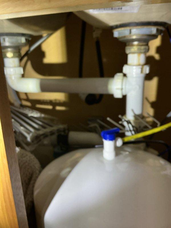Performed plumbing inspection and resolved two issues: 1) Eliminated sewer odor in laundry room by adjusting washing machine discharge hose position in standpipe to prevent trap siphoning, and 2) Cleared slow lab drain by disassembling pop-up assembly and removing hair buildup to improve drainage efficiency.