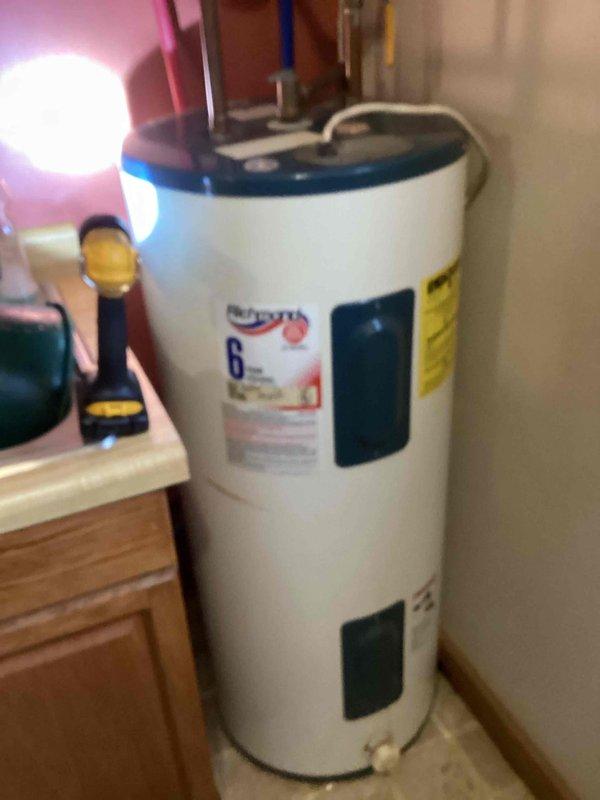 Diagnosed water heater leak in horse barn and determined replacement was necessary. Installed new 40-gallon electric water heater to replace the leaking 6-year model unit.