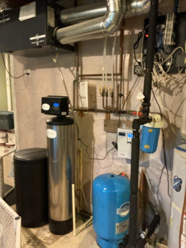Performed annual maintenance on natural gas water heater and resolved restricted water flow issue at kitchen sink. Discovered blockage in hot water supply line causing reduced flow; cleared obstruction by blowing out the line. Completed system flush of water heater, noting absence of calcium and magnesium deposits.