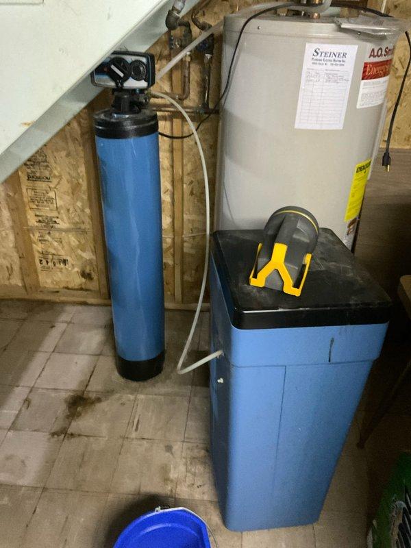 Responded to service call for a water softener that was continuously running and leaking from valve. Diagnosed faulty control valve (model #69) causing the system to remain in regeneration cycle. Replaced valve assembly and verified proper cycling operation. System is now functioning correctly with no leaks observed.