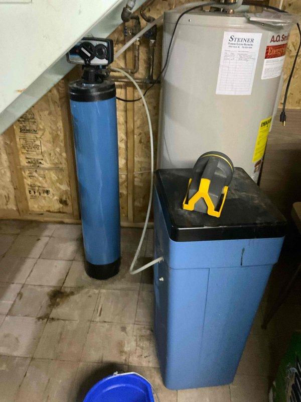 Responded to service call for a water softener that was continuously running and leaking from valve. Diagnosed faulty control valve (model #69) causing the system to remain in regeneration cycle. Replaced valve assembly and verified proper cycling operation. System is now functioning correctly with no leaks observed.