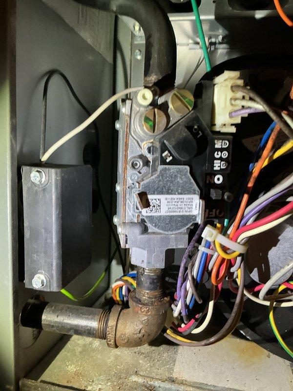 Diagnosed and identified failed gas valve on 7-year-old LP furnace causing no-heat condition. Customer has warranty with another HVAC service provider for gas valve replacement. Also documented need for water heater replacement.