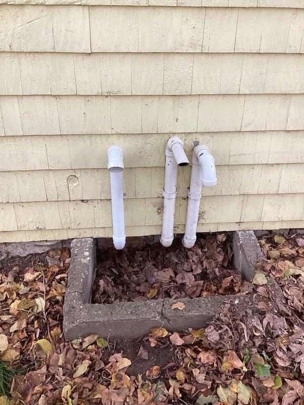 Successfully installed customer-supplied LP water heater with proper pressure-temperature relief valve. Ensured all PVC vent pipes were correctly positioned and secured to the exterior wall, and verified drainage system connections to the main waste line were properly supported with metal hangers against the foundation wall.