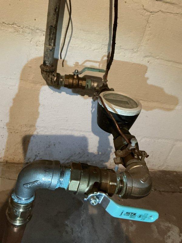 Responded to a service call for a water leak in customer's basement mechanical room near the main water supply. Upon inspection, discovered defective valves installed during previous water service replacement by the village, which were causing persistent leakage. Customer was advised of repair options, and documentation was provided for potential involvement of the village utility department since the issue stems from their original installation work.