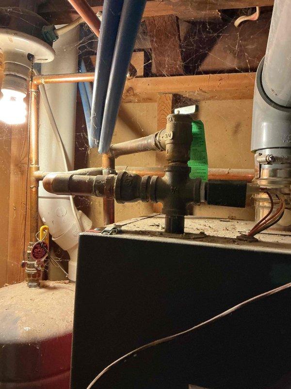 Conducted service call to assess non-operational 16-year-old boiler system experiencing pressure retention issues. Customer reported that pressure relief valve opened prematurely and won't maintain proper pressure following radiator removal work. Unable to perform complete inspection due to system's inability to hold pressure. Provided customer with replacement options for the pressure relief valve, but customer elected to attempt the repair independently.