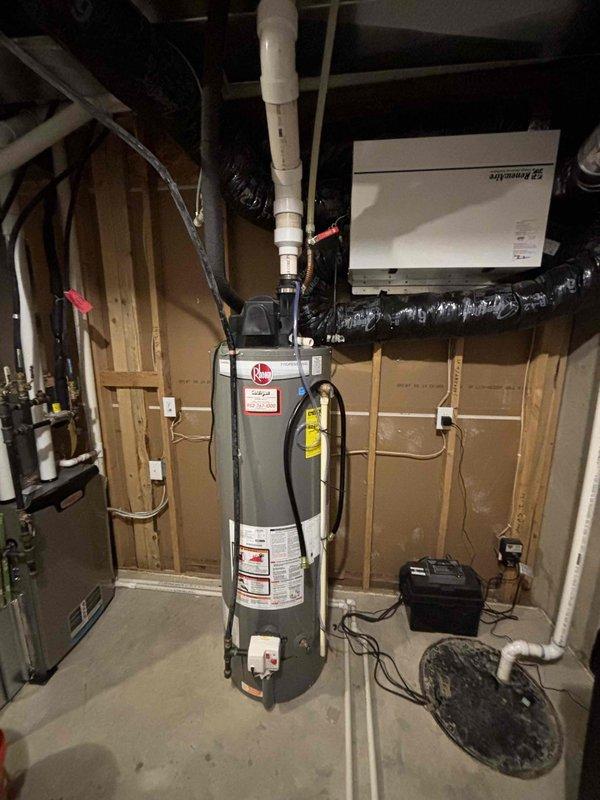 Replaced sacrificial zinc anode rod in customer's water heater as part of scheduled maintenance. Customer's system includes a previously installed pre-filter unit and a water softener system in the utility area. Service completed within the allocated 3-hour timeframe with parts sourced from Oakdale warehouse.