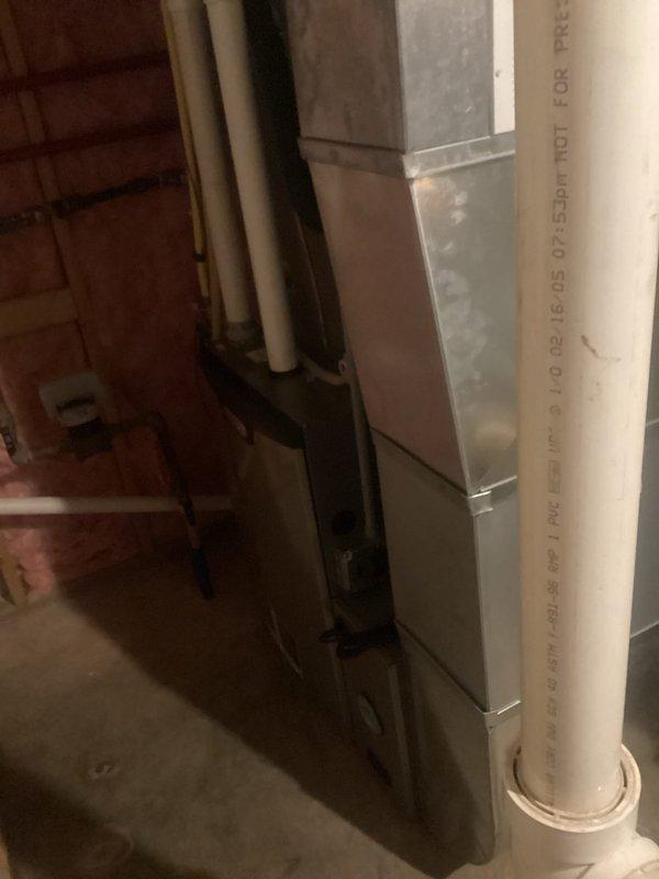 Performed comprehensive furnace tune-up on residential unit. Inspected filter (noted as getting dirty), verified clean and balanced blower, and checked all electrical components finding them within specifications. Identified water damage in upper and lower cabinets from condensate backflow through intake. Unit operation tested at maximum heating rate for 15 minutes with 70°F temperature rise (within 60-90°F specification range). Recommended installation of in-line drain to prevent further condensate damage; customer requested estimate.