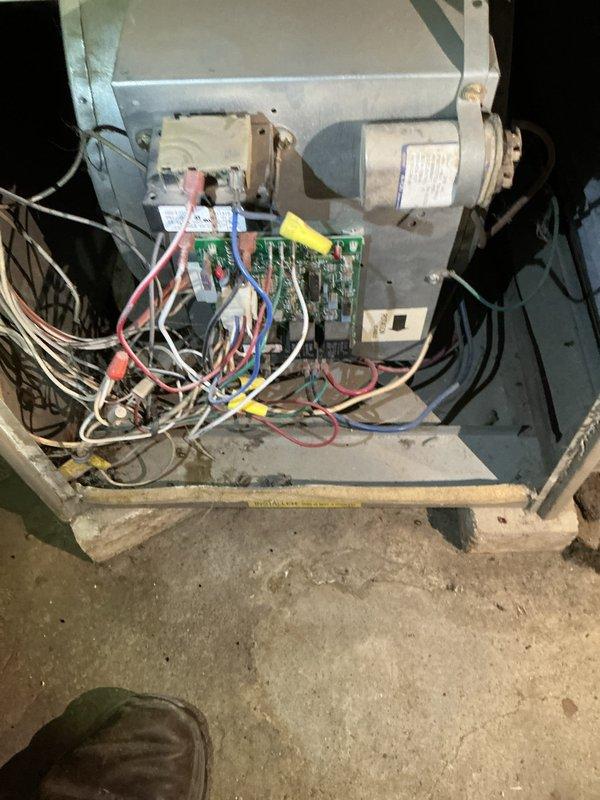 Diagnosed two aging furnaces: a 31-year-old Goodman with a cracked heat exchanger and a 39-year-old Trane with intermittent shutdown issues and an inducer making noise. Inspection revealed 3 ppm carbon monoxide leak from the Trane unit. Both systems had abandoned boiler coils still attached despite boiler removal. Recommended replacement options due to the cracked heat exchanger and unavailability of Trane replacement parts.