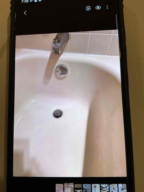 Completed service on multiple plumbing issues including a basement bathtub with a malfunctioning drain latch causing slow drainage and an upstairs toilet with a flush handle that was sticking in the down position, causing continuous tank filling. Inspected both fixtures, documented condition with photos, and performed necessary repairs to restore proper functionality.