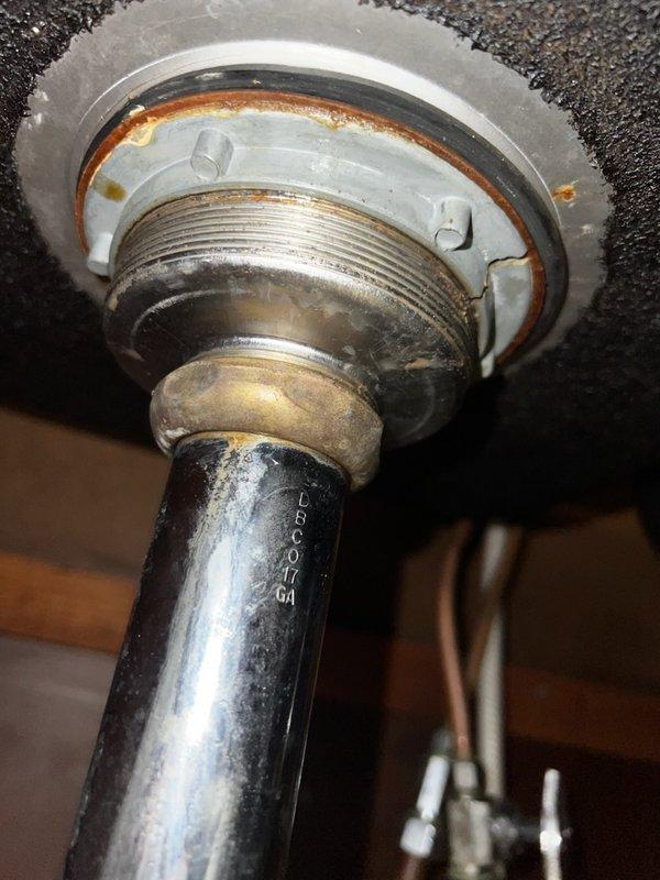 Responded to service call for kitchen sink leakage. Upon inspection, found deteriorated sink baskets and drain assembly with visible corrosion. Replaced both sink baskets and drain assembly in the double-basin stainless steel kitchen sink, resolving the leak issue. Additionally, adjusted sticking toilet lever mechanism to restore proper function.