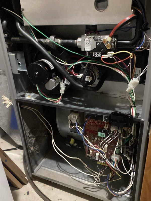 Responded to no-heat call on a 2020 Goodman gas furnace. Diagnosed control board failure as evidenced by erratic display showing nonsense characters and periodic blank screen. Board was non-responsive to thermostat calls and direct jumper testing despite proper voltage supply. Removed defective control board and installed new replacement board, restoring normal heating operation.