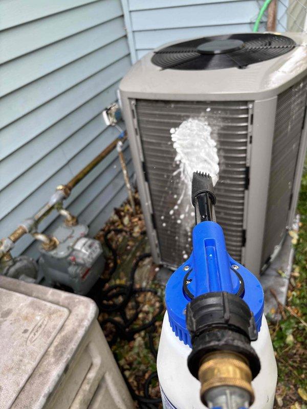 Performed annual Family Rewards furnace tune-up on 2-year-old system. Cleaned severely blocked heat pump condenser coils using pressure washer to restore proper airflow and efficiency. Replaced furnace filter and ran full diagnostics on S30 thermostat, noting potential flame sensor issue reading stuck at 2 which may require follow-up service.