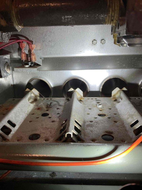 Inspected customer's 25-year-old furnace due to concerns about heat exchanger condition. Confirmed previous technician's findings of excessive rust, temperature stress, and wear where pipes connect to the manifold. Observed heat exchanger showing significant stress that presents a potential safety risk but does not yet warrant immediate condemnation. Tested and cleaned flame sensor which showed weak performance (1-1.7 µA). Scheduled service advisor for new furnace estimate and will provide separate estimate for heat exchanger and flame sensor replacement.