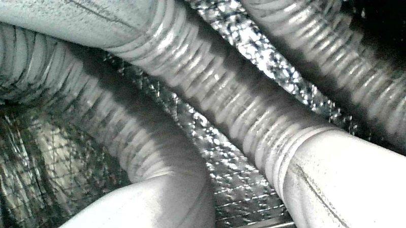 Performed annual furnace tune-up under family rewards program. Cleaned flame sensor, verified proper condensate drainage, and inspected heat exchanger which showed no concerns. Noted developing cracks around collector box screw holes with minor leakage. All electrical components tested within specifications. System startup confirmed proper operation with 55° temperature rise. Provided customer with repair estimate for collector box replacement via email for future consideration.