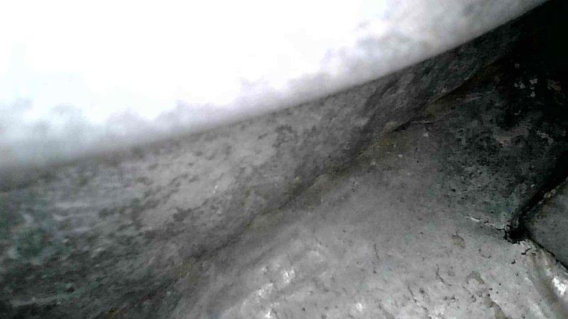 Performed scheduled furnace tune-up on original 1995 unit. Inspection revealed cracked heat exchanger, which poses significant safety risk. Due to component failure and equipment age (27 years), full system replacement was recommended and completed. Visual documentation captured heat exchanger damage and existing installation configuration prior to replacement.