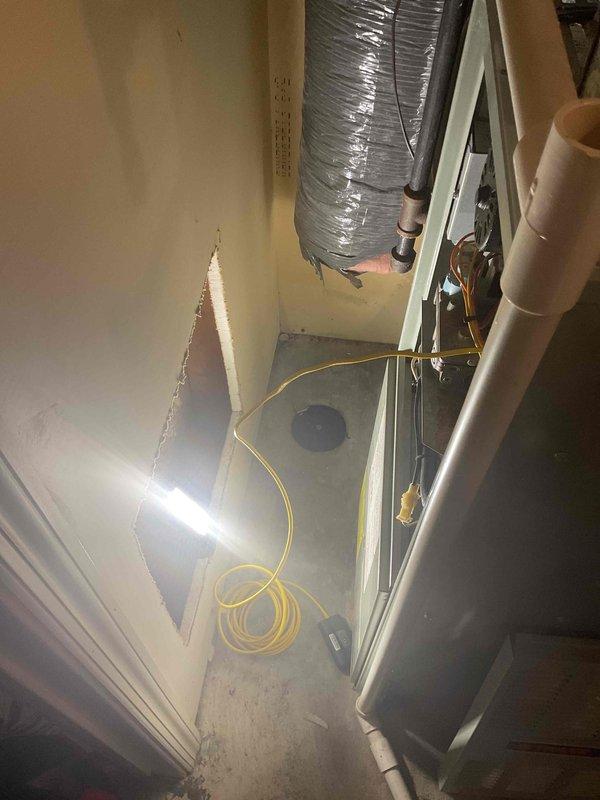 Performed scheduled furnace tune-up on original 1995 unit. Inspection revealed cracked heat exchanger, which poses significant safety risk. Due to component failure and equipment age (27 years), full system replacement was recommended and completed. Visual documentation captured heat exchanger damage and existing installation configuration prior to replacement.