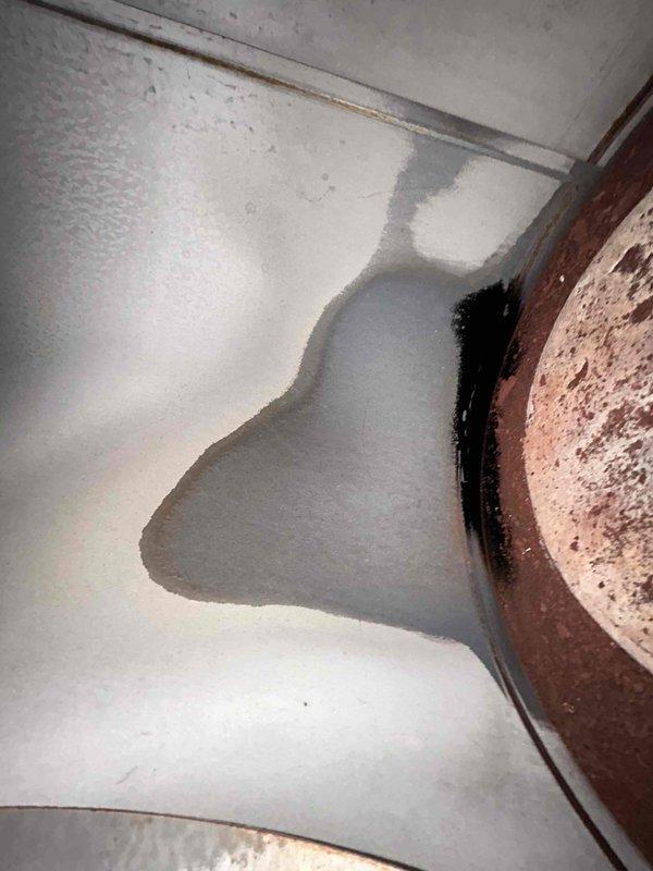 Diagnosed and serviced mobile home furnace that was reportedly shutting off in auto mode but working in manual mode. System was functioning properly during inspection, but discovered and replaced weak capacitor as preventative measure. Customer also reported gas odor from stove - soap tested fittings and found no leaks in the flex line, advised issue likely within stove itself which is outside our service scope. Customer was informed that waste oil burner in shop requires specialized service not offered by our company.