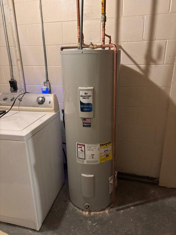 Diagnosed and replaced a 40-year-old electric water heater (manufactured in 1983) that was providing no hot water. Installed a new 50-gallon electric water heater to replace the original 40-gallon unit, properly connecting to existing copper supply lines with appropriate valves. Customer authorization obtained via landlord's credit card on file prior to replacement.