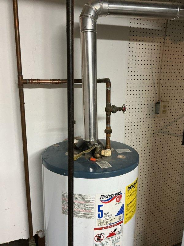 Replaced cracked water heater drain valve that had previously detached twice, causing water to fill the basement. Inspected all connections to ensure proper installation and prevent future leakage.