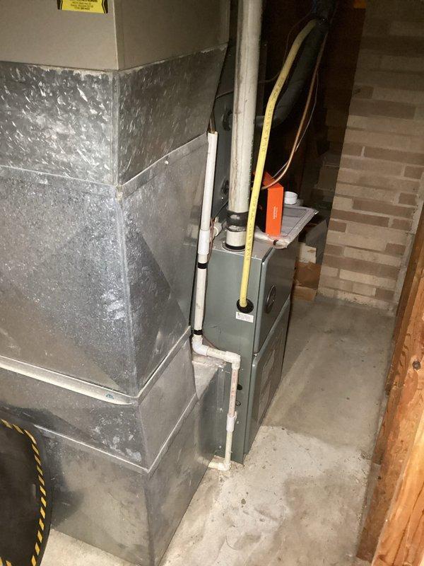Performed routine furnace tune-up on aging FRP unit. Replaced customer-supplied air filter, inspected primary and secondary heat exchangers with no compromises found. All electrical components, capacitors, and gas pressures tested within specification with proper temperature rise of 65 degrees. System operated normally during 15-minute test run after condensate lines were cleared.