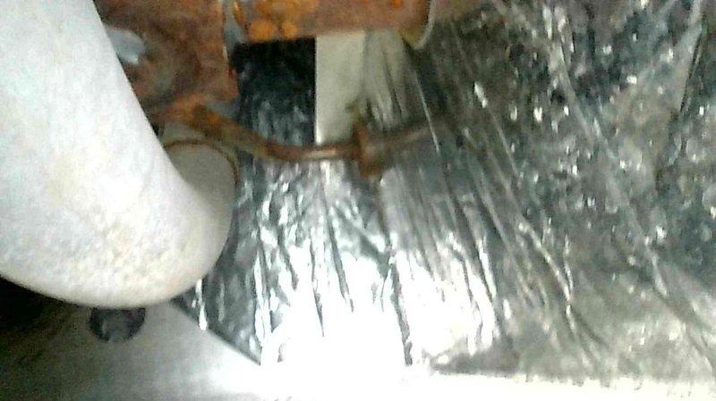 Performed tune-up service on 30+ year old Lennox Pulse furnace. Identified and replaced broken elbow connecting to exhaust where pressure switch attaches. Inspection revealed compromised heat exchanger with extensive corrosion and deterioration documented in photographs. Due to age of unit and limited parts availability, recommended complete system replacement. Scheduled sales consultant for replacement quote.