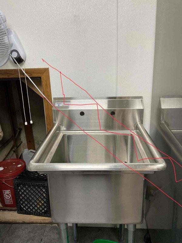 Connected commercial stainless steel utility sink to waterline in utility room. Installed single basin sink with backsplash against wall, ensuring proper water connections. Verified system functionality after installation.